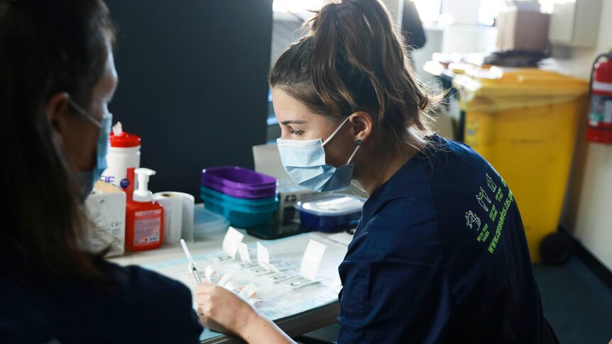 Nurses at a COVID-19 vaccination clinic, Moonah, Tasmania, 29 June, 2021