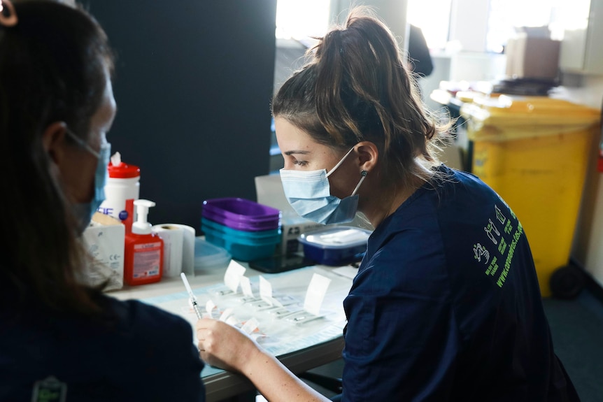 Nurses at a COVID-19 vaccination clinic, Moonah, Tasmania, 29 June, 2021