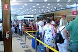 Passengers line up at Hobart airport