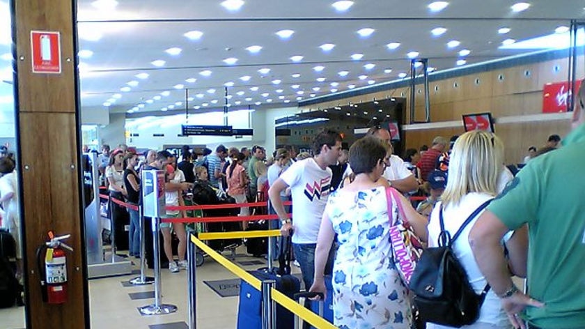 Passengers line up at Hobart airport