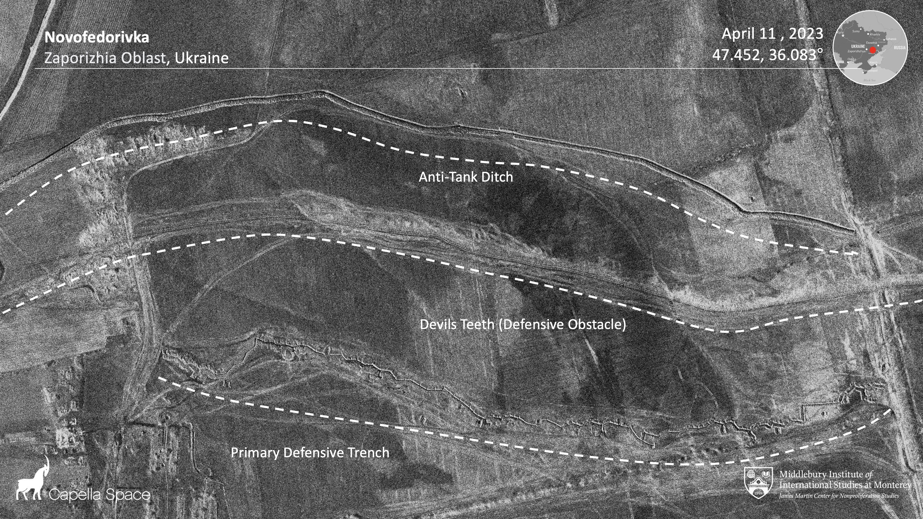 A black and white image is marked up with white writing showing large areas where Russian forces have dug anti-tank trenches