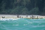 Sentinelese stand guard on the beach