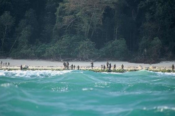 Sentinelese stand guard on the beach.
