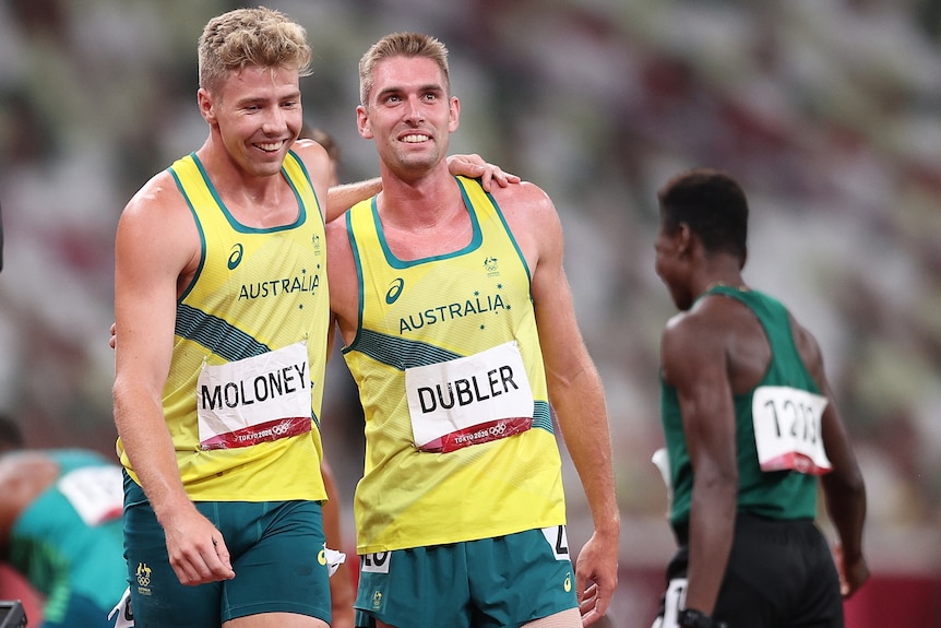Two Australian decathletes with their arms over each other's shoulders as they celebrate following their event.
