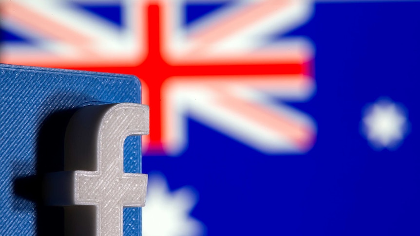 A 3D printed Facebook logo is seen in front of displayed Australia's flag in this illustration.