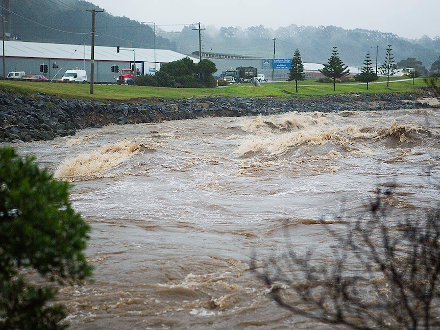 Choppy brown water in the Emu River, which has broken its banks in Burnie, Tasmania.