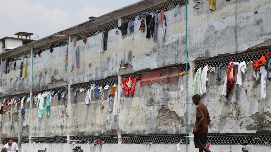 An inmate walks on the roof of one of Colombia's most crowded prisons.