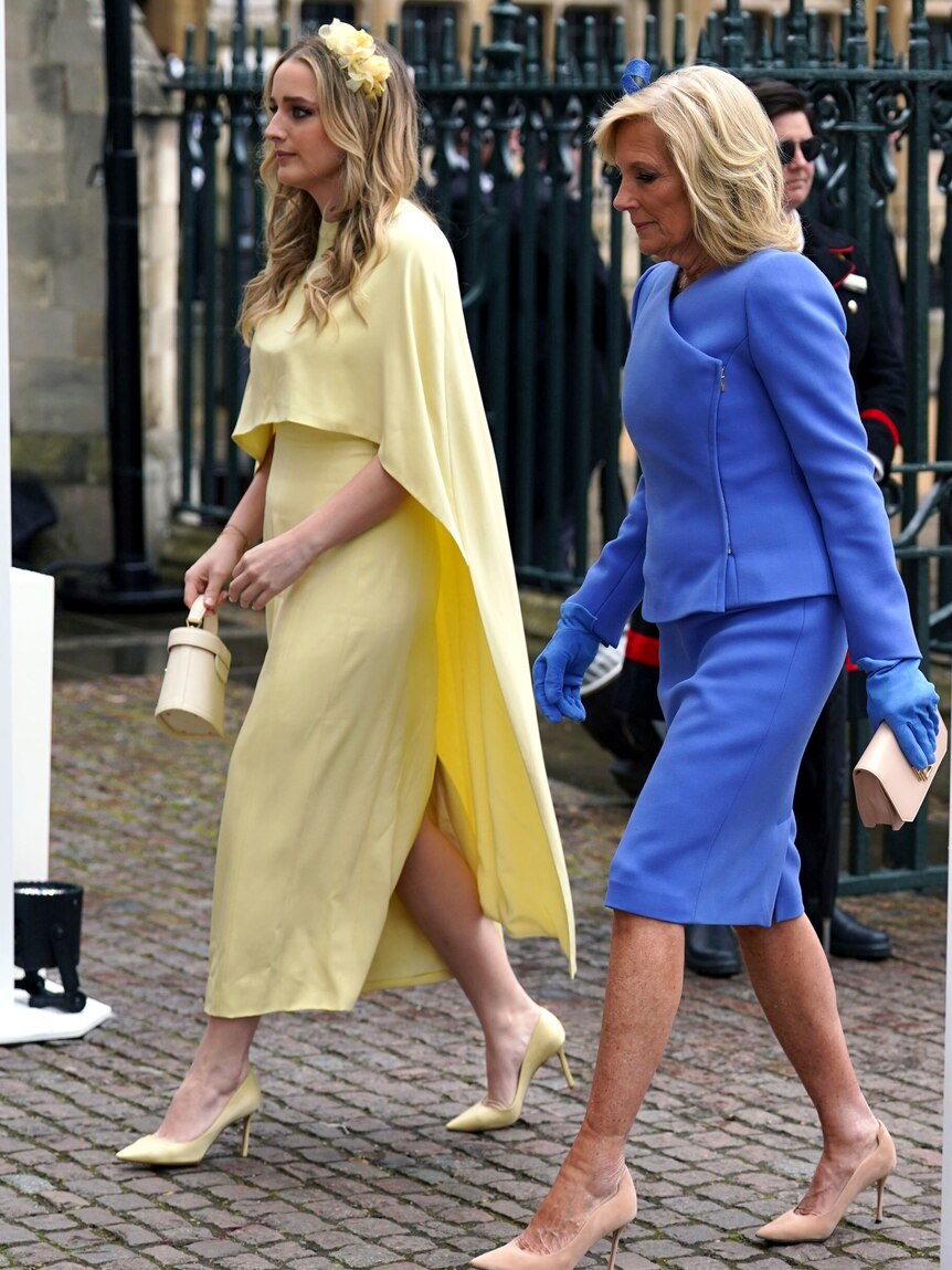 Two women walking next to each other