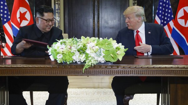 Donald Trump and Kim Jong-un jointly sign memorandum