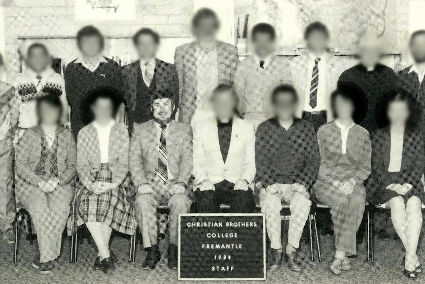 A group of school teachers pose for a photo. 