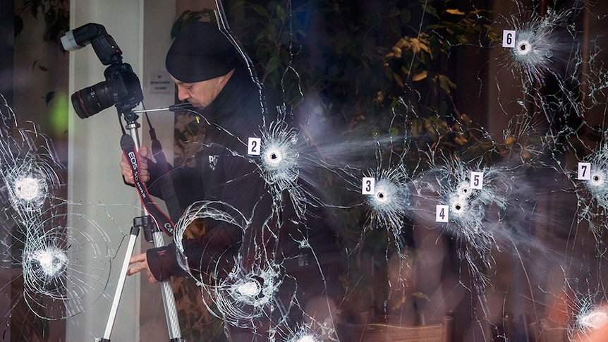 Bullet holes in a Copenhagen cafe, where police killed the man behind deadly attacks on a synagogue and a protest.