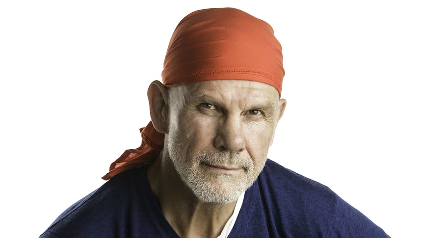 A portrait of Peter FitzSimons in a red bandana.
