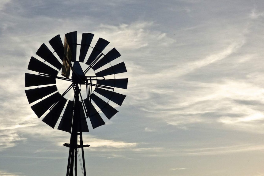 A windmill against a sunset near Jugiong, NSW.