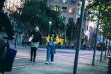 Two young women walking in Ultimo
