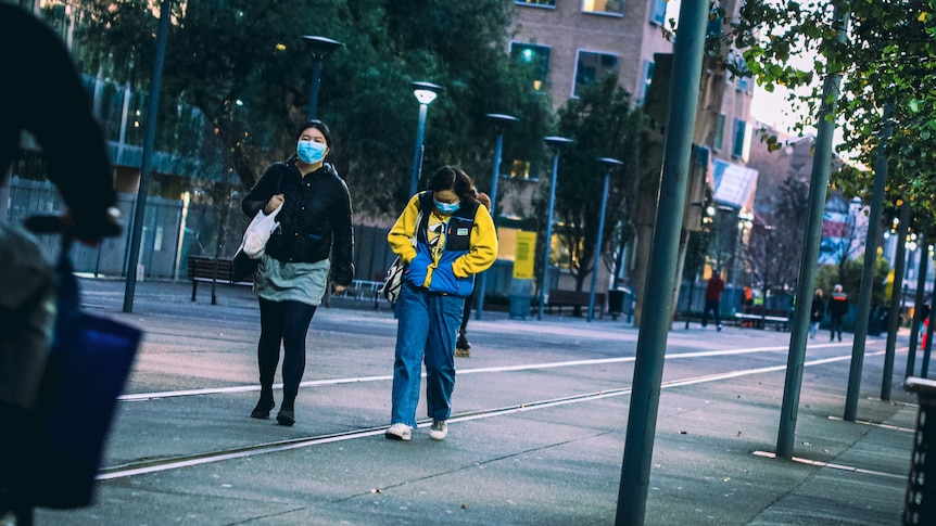 Two young women walking in Ultimo