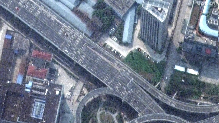 Satellite imagery shows a deserted highway running through Wuhan, China.