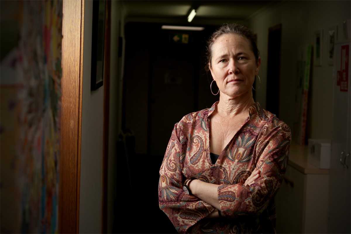 A woman standing with her arms crossed