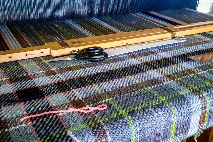tartan fabric on a loom