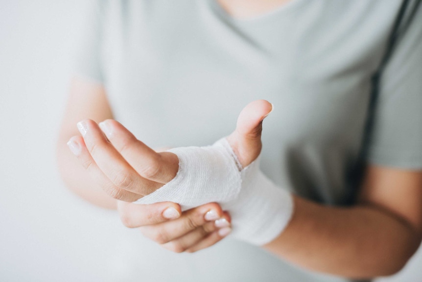 A hand with a white bandage