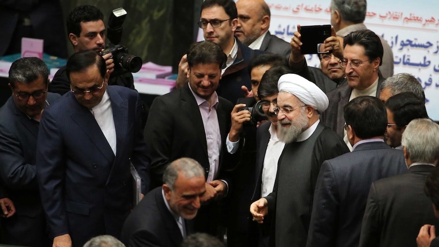 Iranian President Hassan Rouhani arrives in parliament.