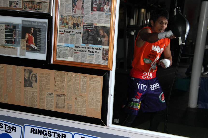 World champion boxer Jack Asis trains near newspaper articles about fellow Toowoomba boxers