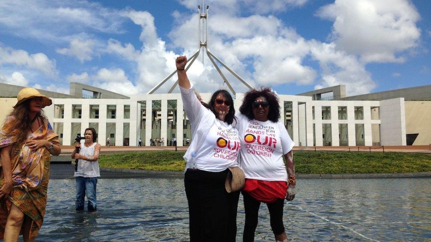 Two members of the group Grandmothers Against Removal outside Parliament House in Canberra.