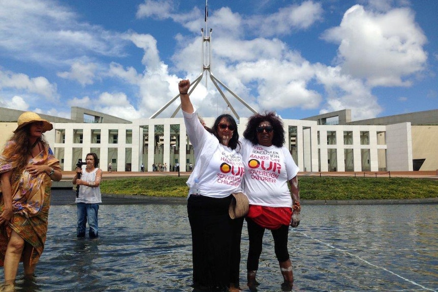 Two members of the group Grandmothers Against Removal outside Parliament House in Canberra.