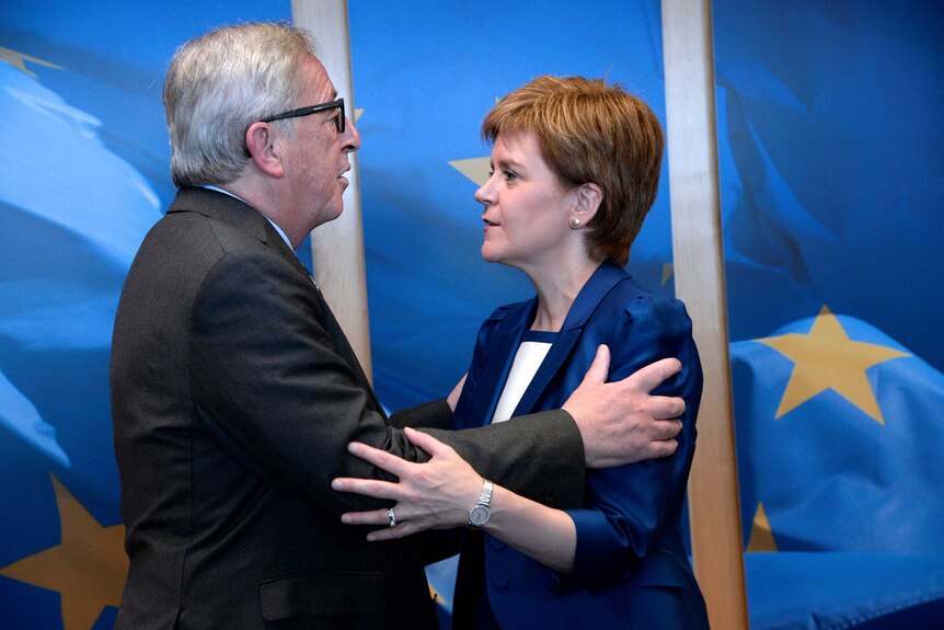 Jean-Claude Juncker and Nicola Sturgeon embrace.