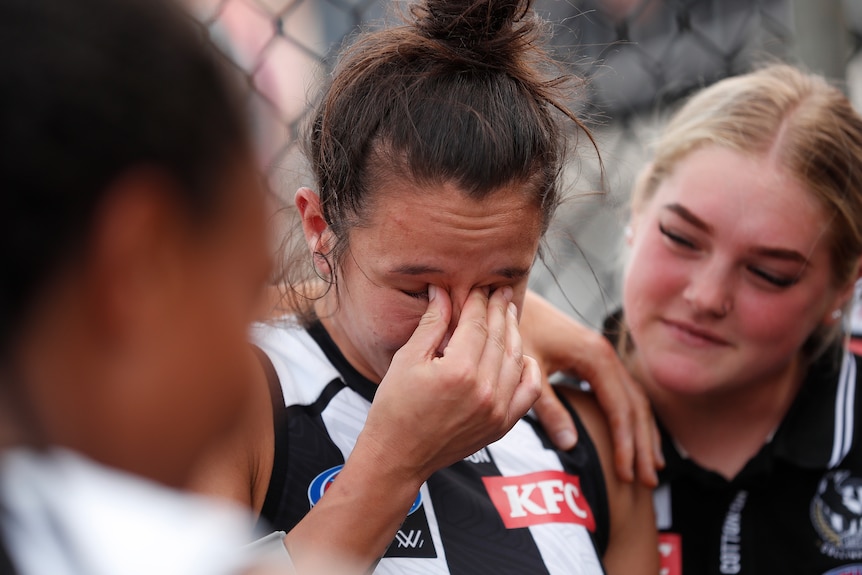 Brittany Bonnici of the Magpies sheds a tear after injuring her knee during the 2022 AFLW Round 08 match