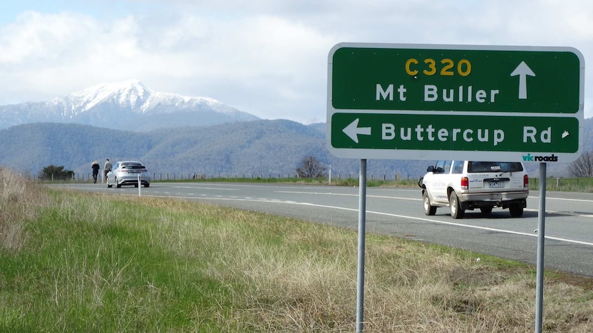 Mount Buller in the distance near road sign