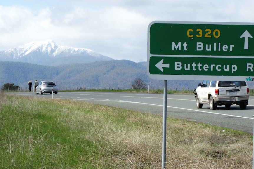 Mount Buller in the distance near road sign