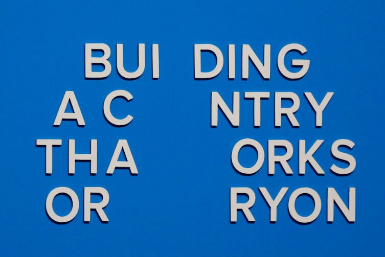 The slogan is seen after more letters fell off immediately after the address. It now reads: BUI DING A C NTRY THA ORKS OR RYON