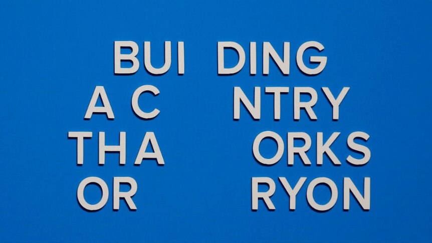 The slogan is seen after more letters fell off immediately after the address. It now reads: BUI DING A C NTRY THA ORKS OR RYON