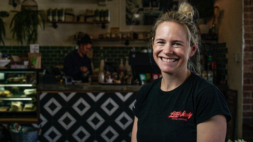Cafe owner Katie Murray stands in front of the counter at her Walgett cafe