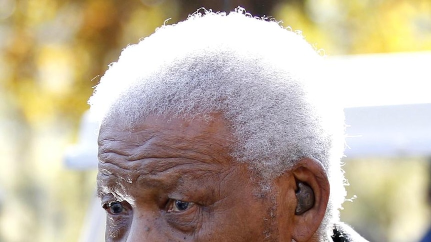 Former South African President Nelson Mandela leaves a memorial service
