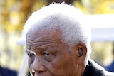 Former South African President Nelson Mandela leaves a memorial service