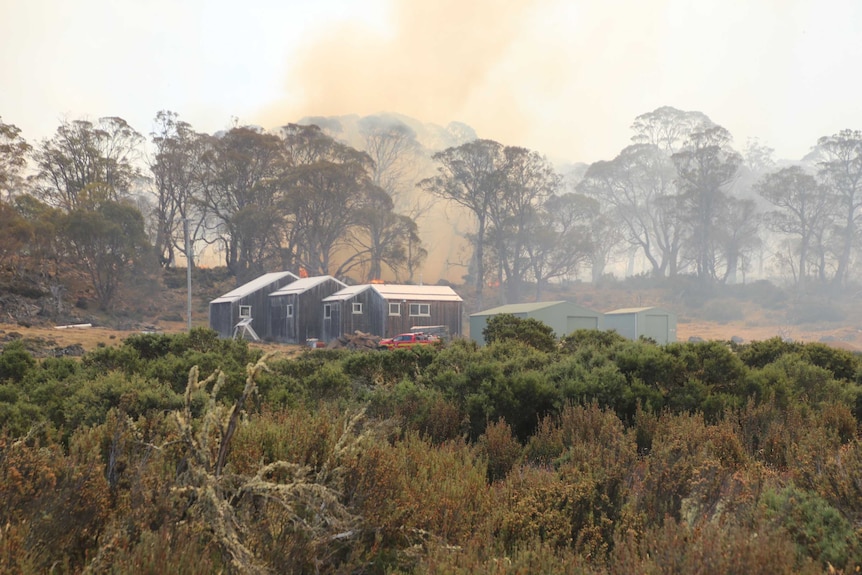 Fire threatening a parks and wildlife workshop at Liawenee.