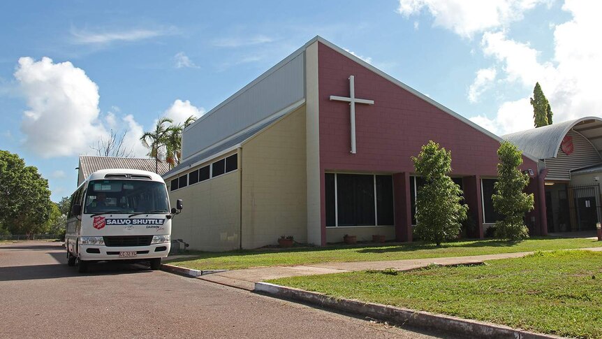 A photo of a bus parked beside the Salvation Army's Darwin office on a bright morning.