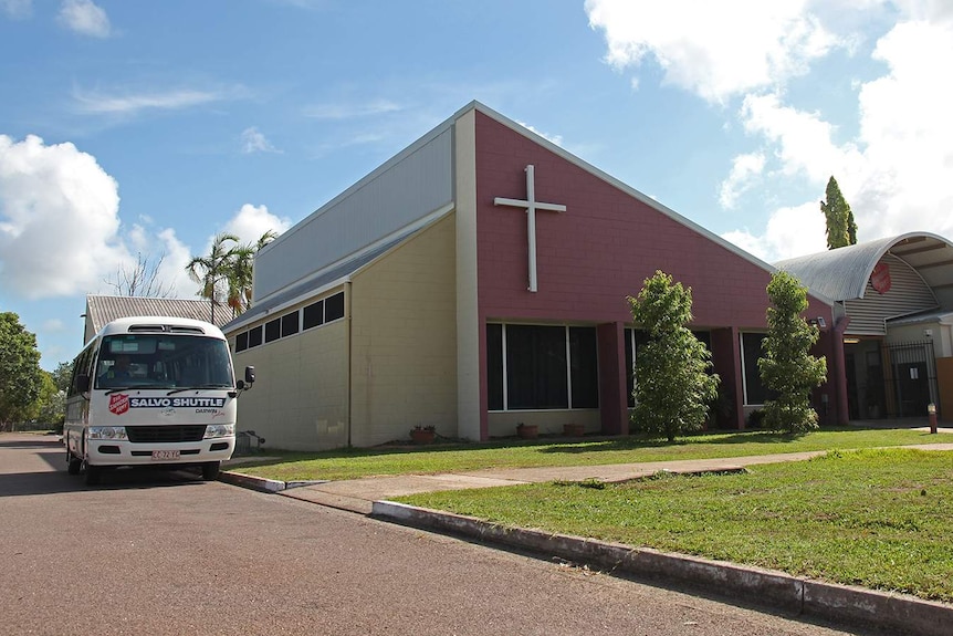 A photo of a bus parked beside the Salvation Army's Darwin office on a bright morning.