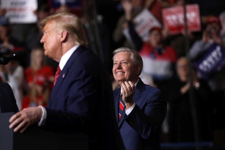 Lindsey Graham and Donald Trump at a rally