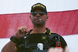 Proud Boys leader Henry "Enrique" Tarrio wears a hat that says The War Boys during a rally in Portland, Oregon.