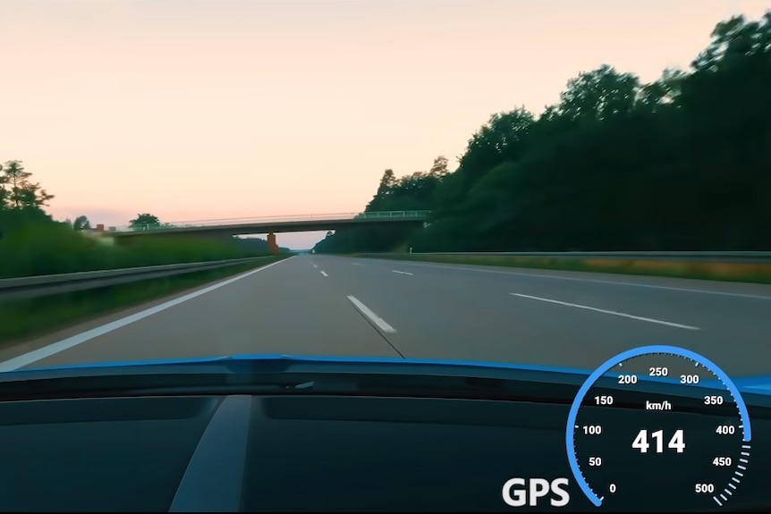 View from inside a Bugatti Chiron with a speedometer showing 414kph.