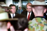 Alexander Downer and Peter Reith with soldiers in 2001