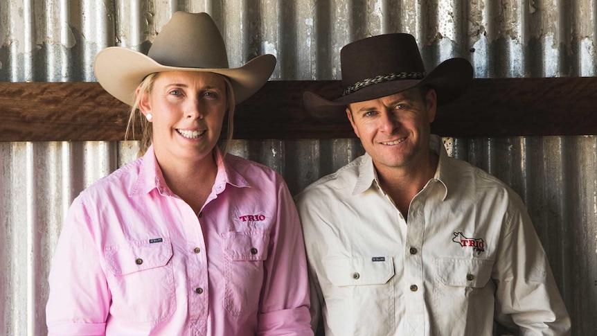 Matt Cherry and Shelley Piper stand together in a farm shed