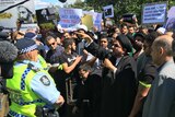Several hundred people at the Saudi Arabian embassy in Canberra.