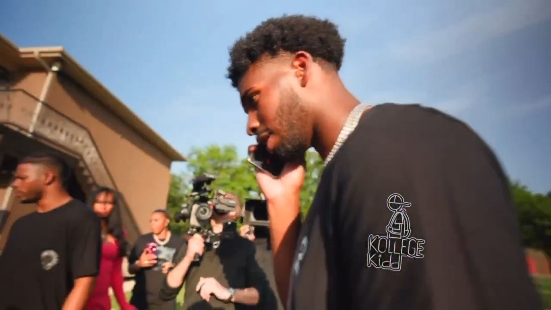 Shedeur Sanders on the phone.