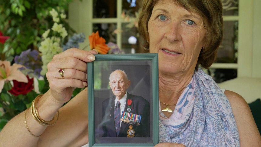 Lorraine Marshall with a photo of her late father, WW2 veteran Murray Maxton