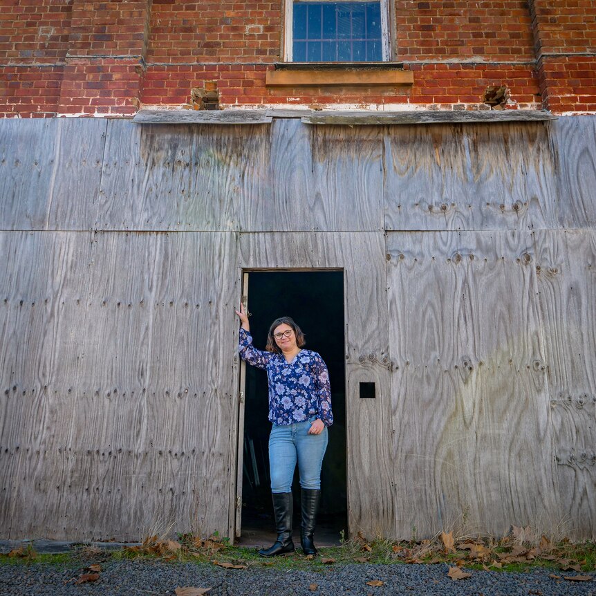Lee-Ann Elmes stands in the empty warehouse that will be her youth centre