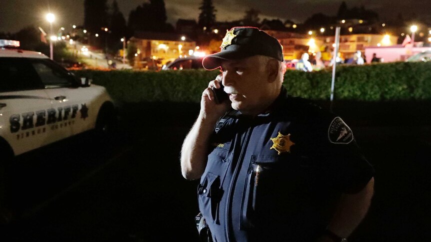 Sheriff talks on phone at staging area after plane stolen in Seattle