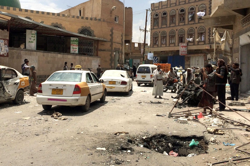 The hole left in the road by the car bomb outside the Al-Muayad mosque.